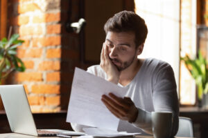 A man looking at business debt.