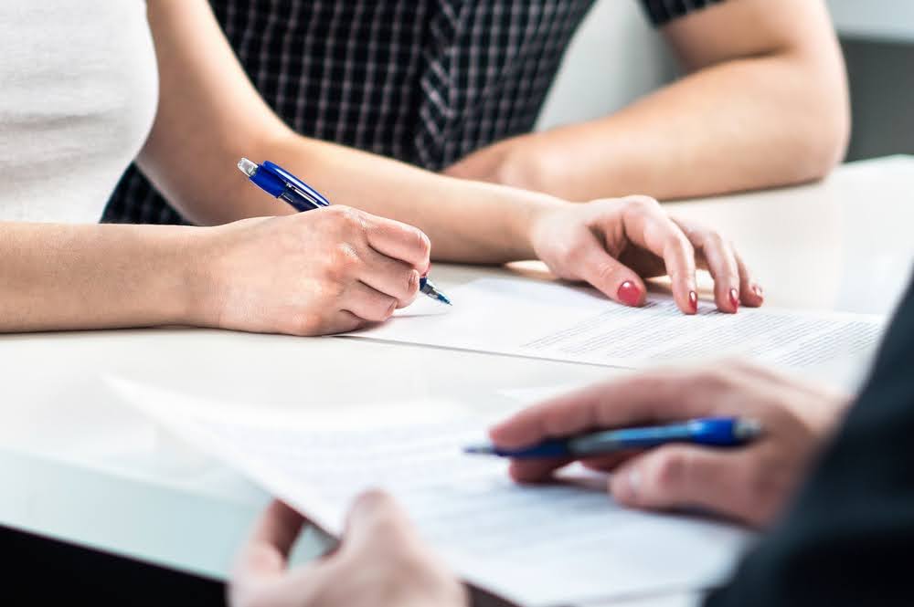 A Financial advisor explains to his clients why debt restructuring is a good idea.