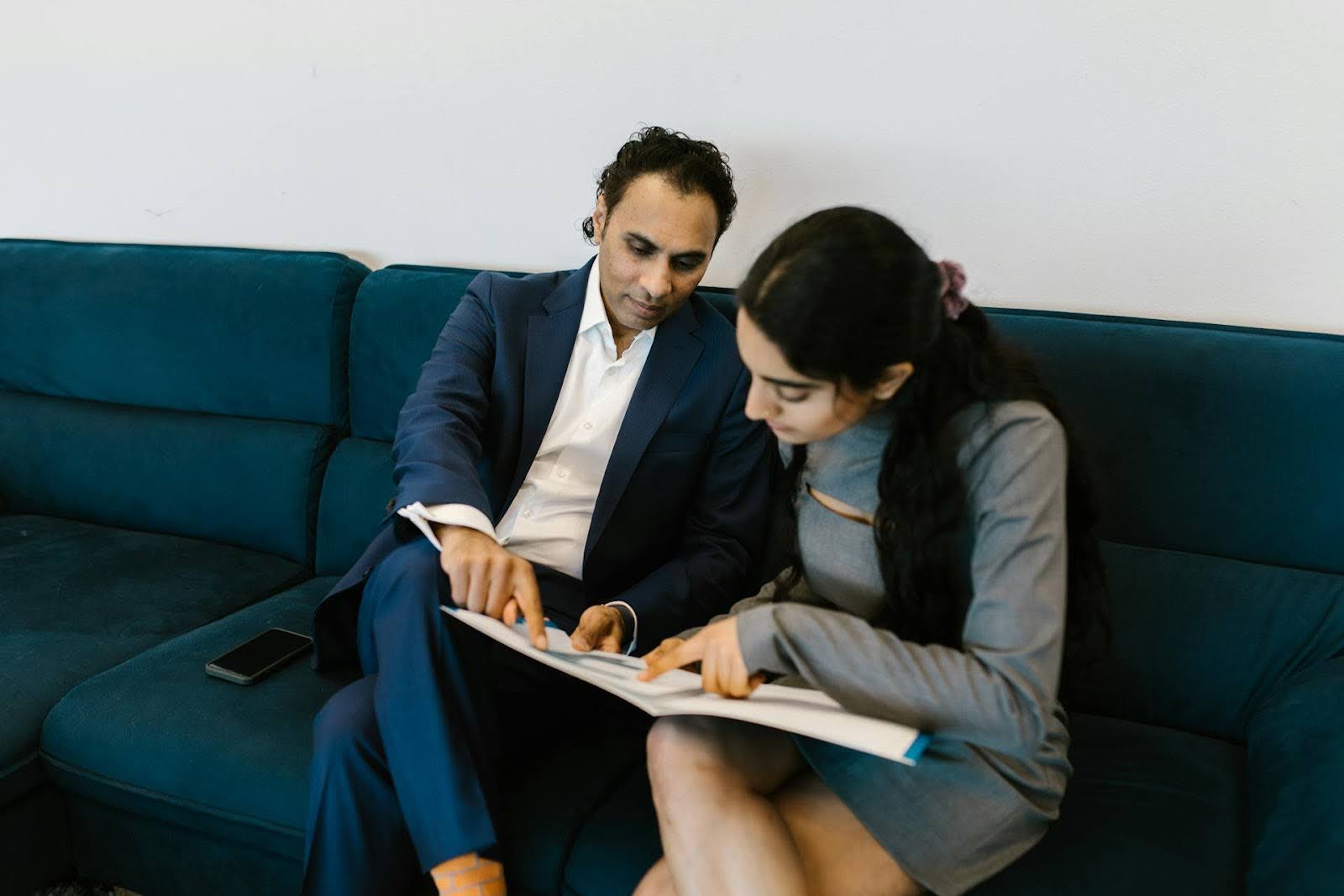 Two people working on KPIs for their business.
