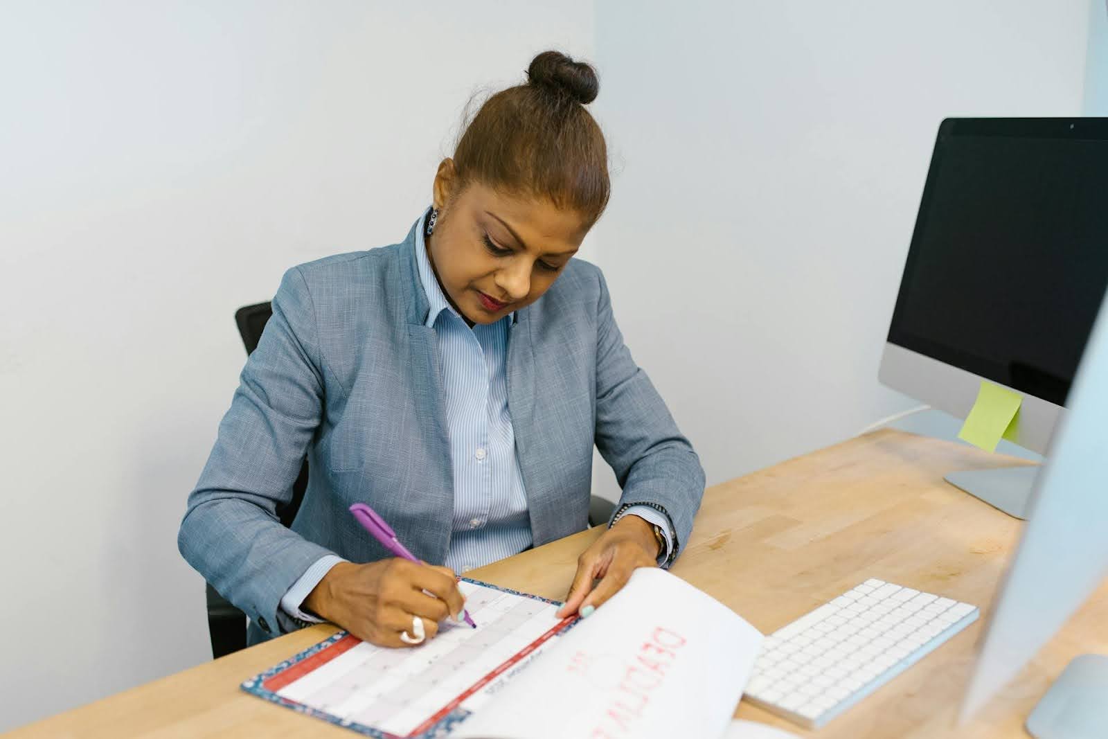 A businesswoman working on a business schedule.