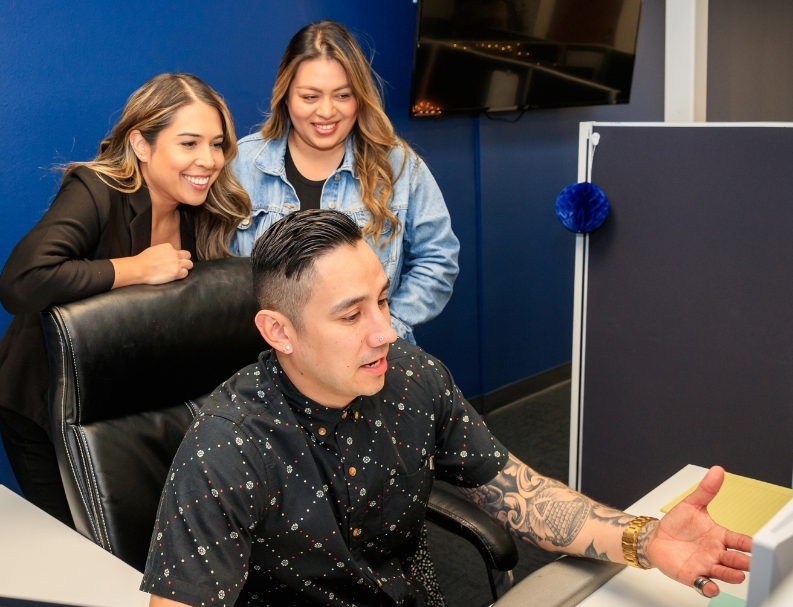 Part of our PRG team - Lindsey, Ana, and Jourdan, working on a problem for the client.