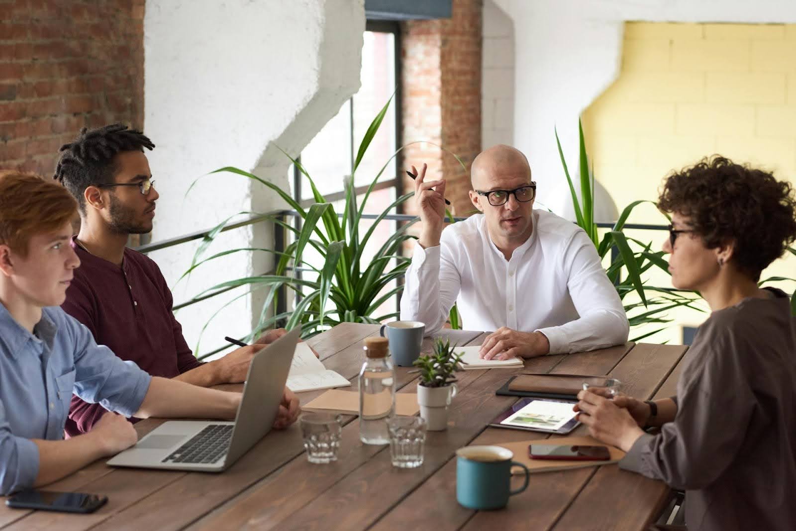 A group of people negotiating a debt settlement.