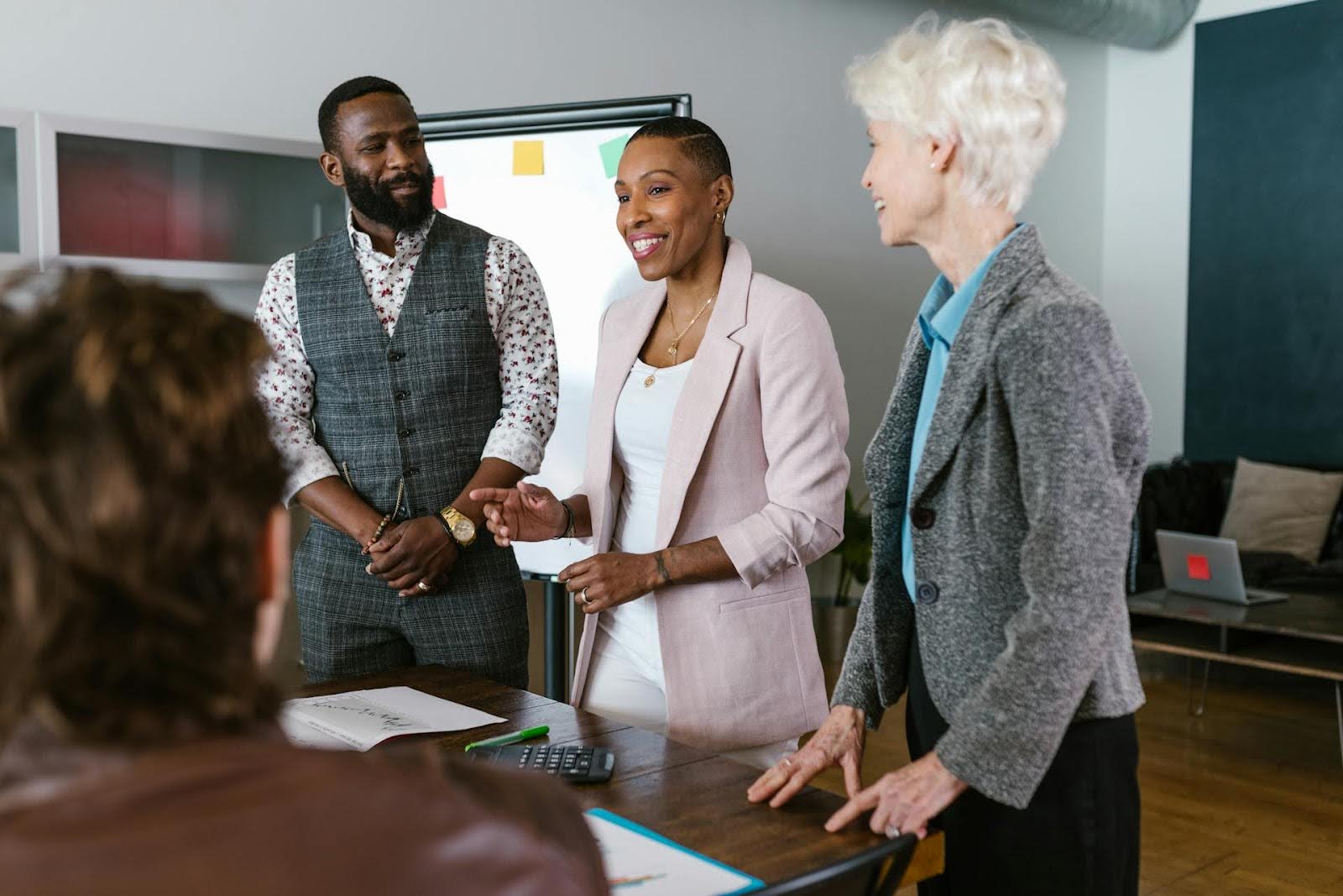 Colleagues working on rebuilding business with a profit-first mindset.