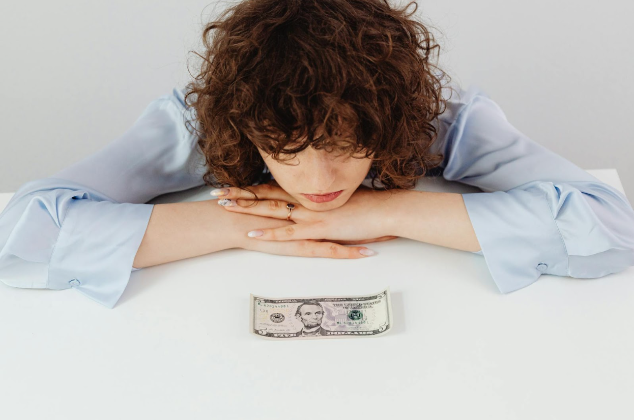 A woman struggling with debt repayment