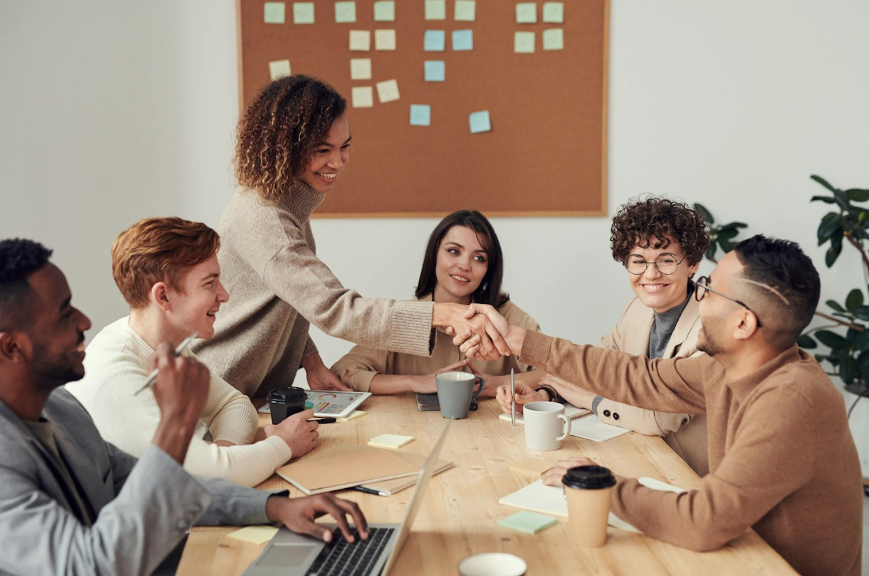 Two people shaking hands after a successful business meeting.