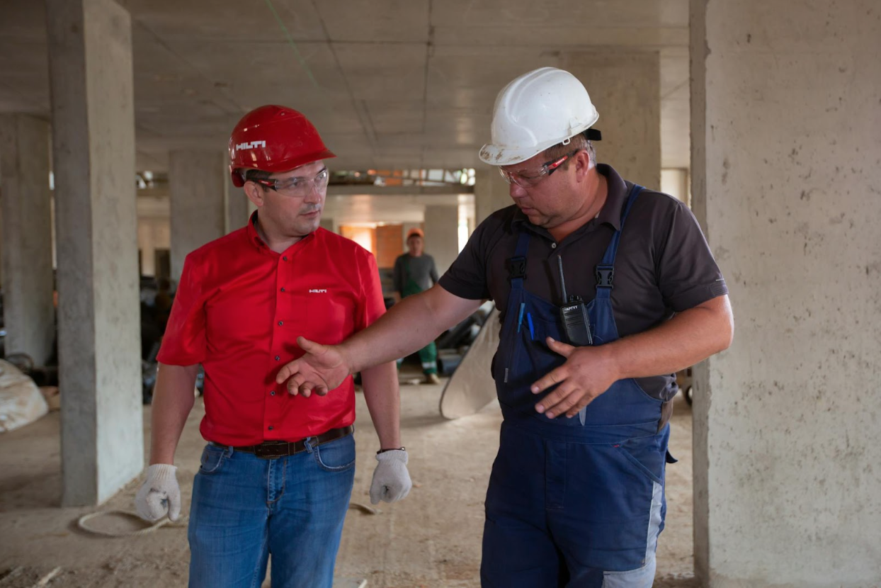 Two construction business owners discussing how a merchant cash advance can bankrupt a business.