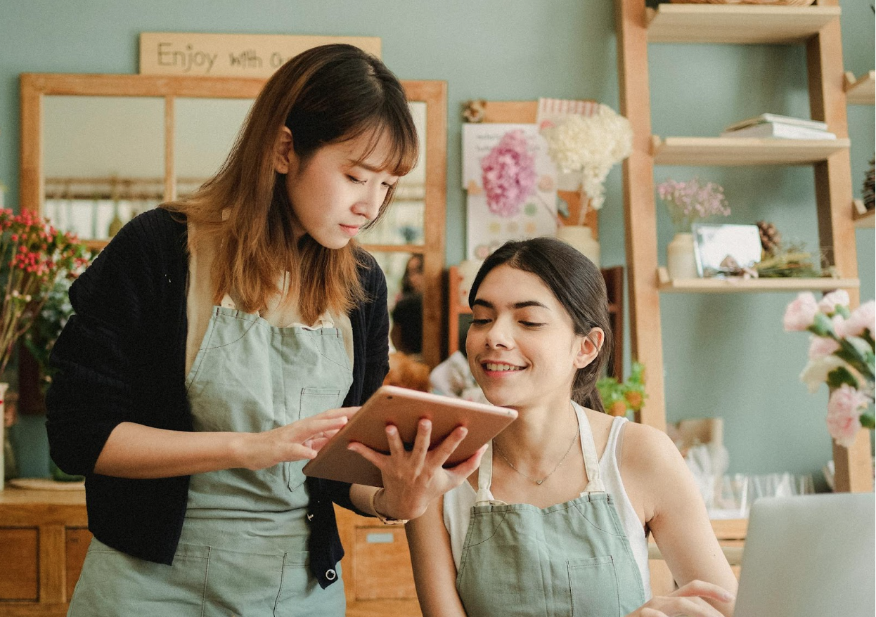 Two small business owners researching UCC liens.