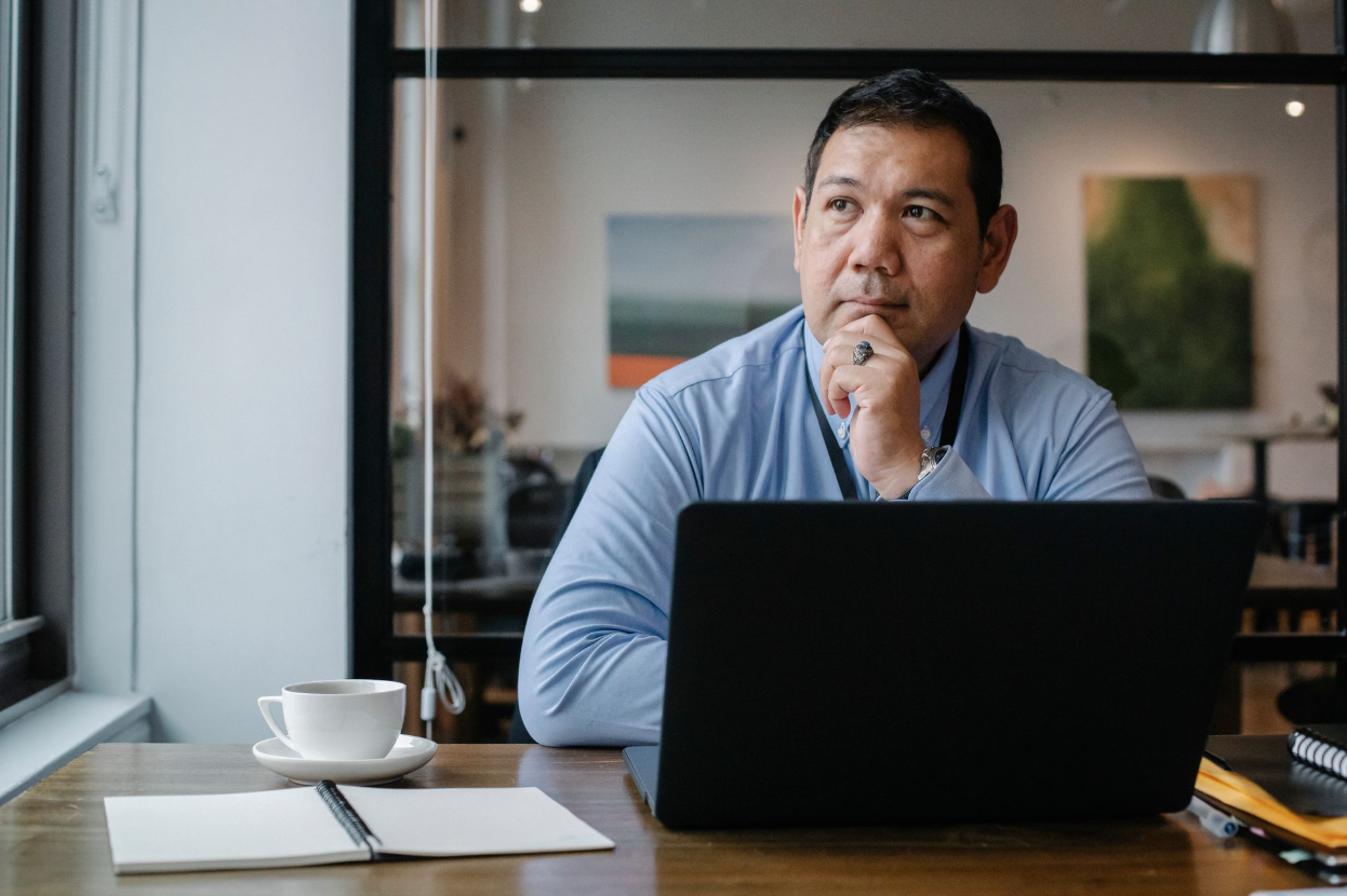 A businessman evaluating his bookkeeper.