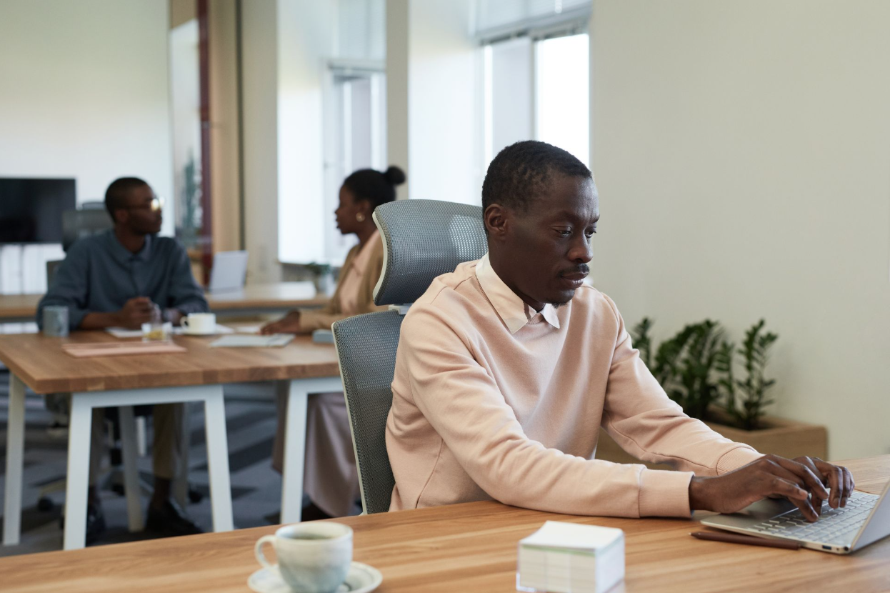 A businessman working on an evaluation for his bookkeeper.