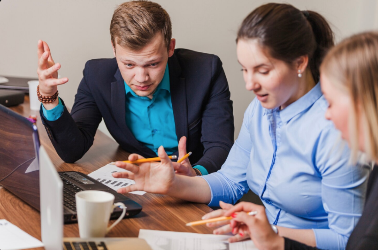 Coworkers analyzing strategies for business debt restructuring.
