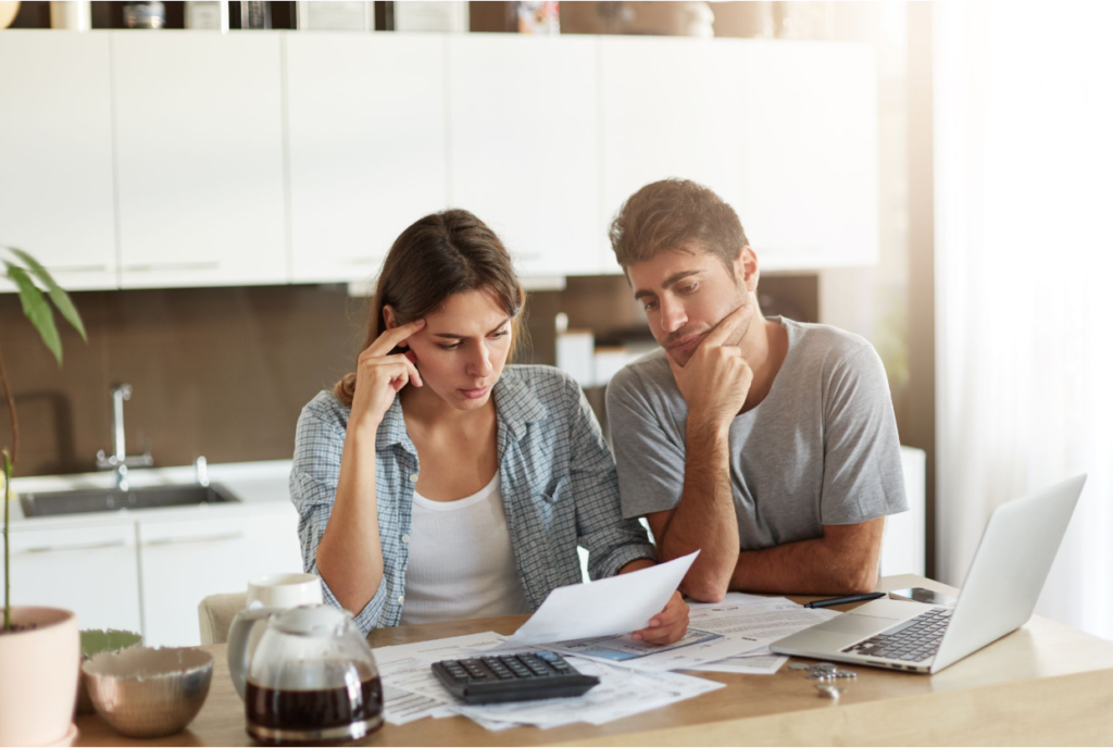 Young couple trying to figure out if the debt settlement company is the right one.