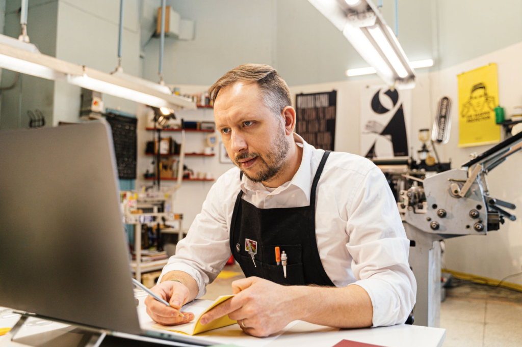 A businessman reading a profit and loss statement.